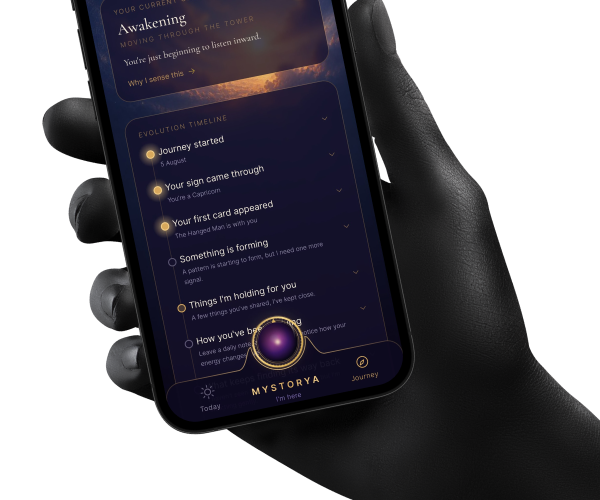 A hand holding the Mystorya Journey screen - an evolution timeline marking moments like your sign coming through and your first card appearing
